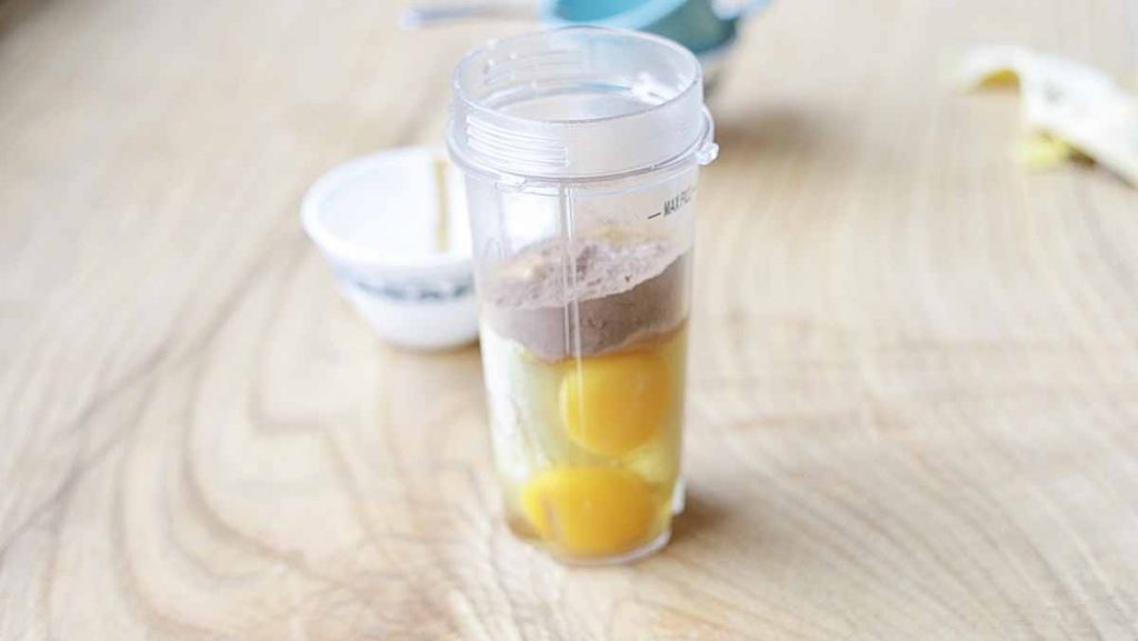 ingredients paleo mug pancake all in a single blender container before it is blended