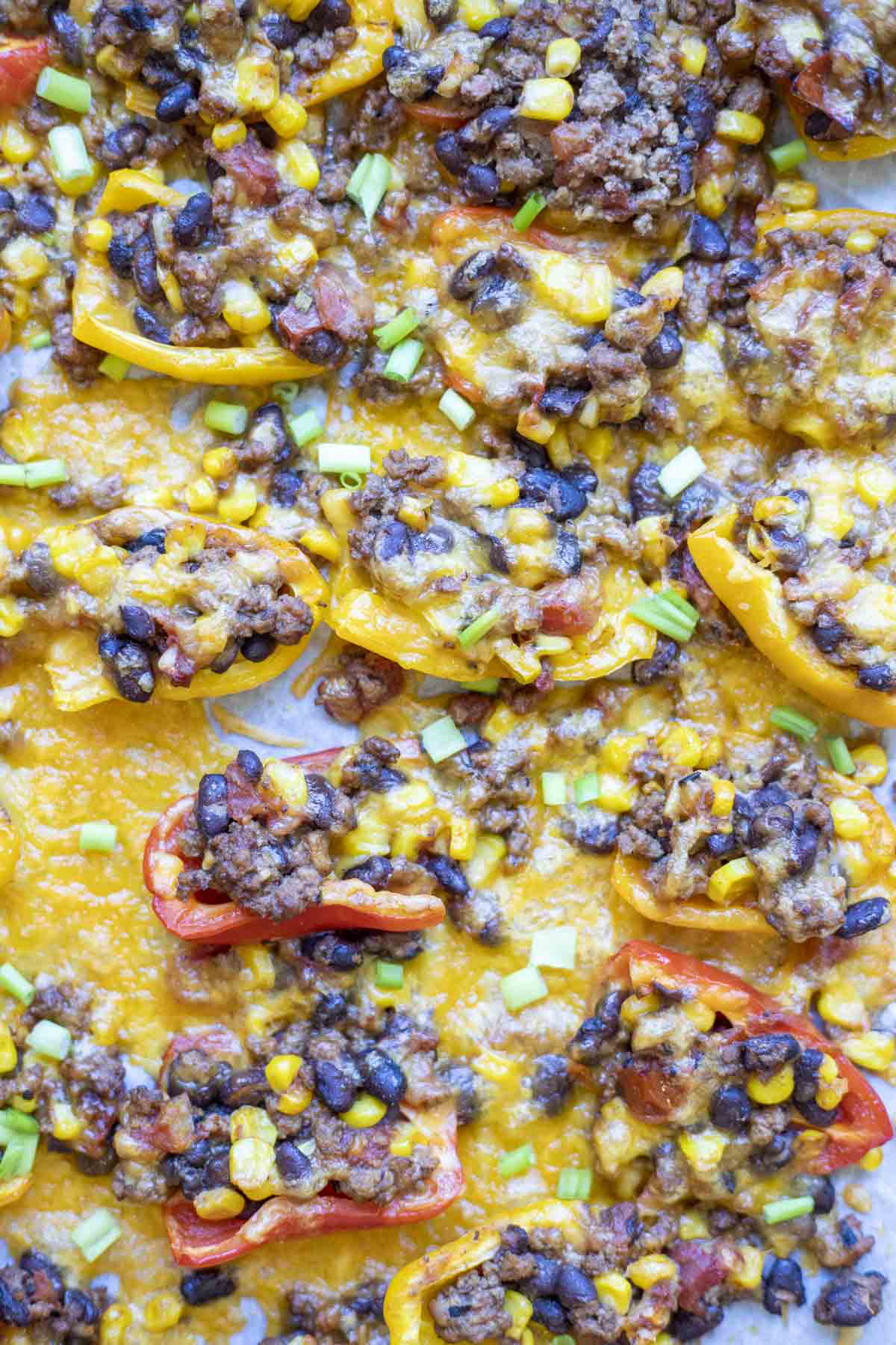 close up of nachos on sheet pan